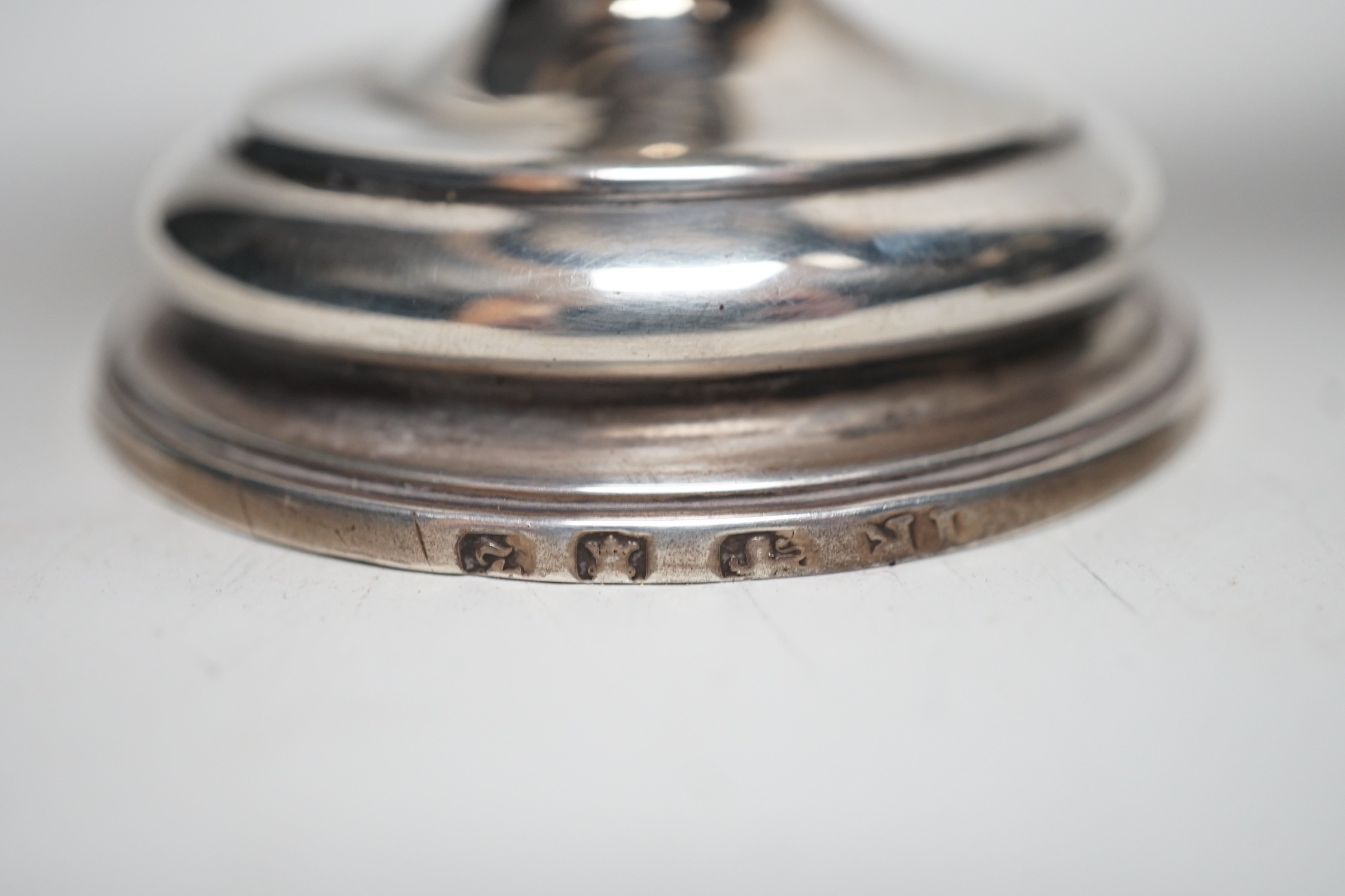 Two late 18th century white metal mounted pedestal coconut cups, one hallmarked silver for John Robbins?, London, 1764, 14.4cm, the other with white metal mounted top rim, on turned wooden base.